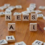 How to Use AI for Social Media Scheduling and Content Planning in 2026 Wooden Scrabble tiles spelling 'AI' and 'NEWS' for a tech concept image.